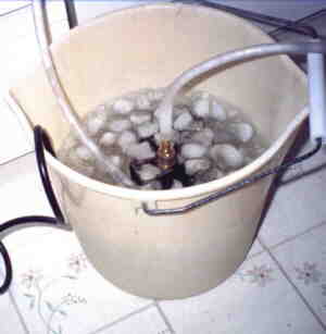 cooling bucket with pump and ice in the water